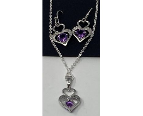 A pair of silver, amethyst and diamond set earrings, and a matching necklaceThis is a modern copy 