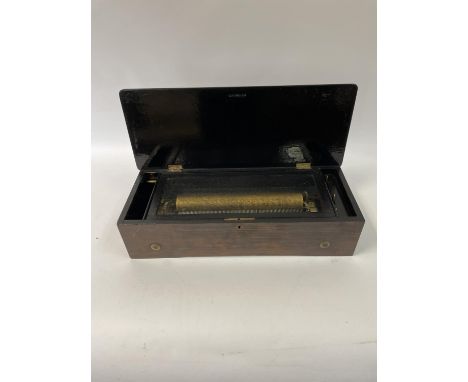 A 19th century lever wind cylinder music box, with a 33 cm wide comb, in a rosewood, marquetry inlaid and stained wood case, 