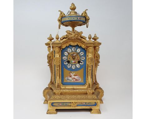 A late 19th century mantel clock, the 8.5 cm wide porcelain dial with Roman numerals and painted a cherub and birds, fitted a