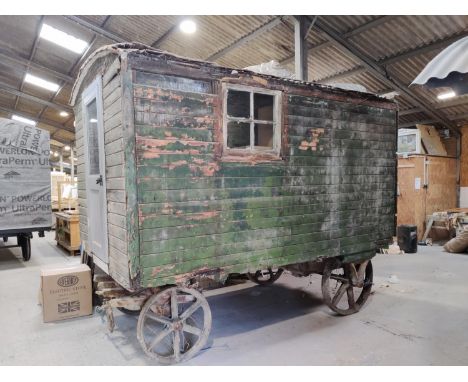 A late 19th/early 20th century roadman's living van, possibly by Eddison, of traditional plank construction, on cast metal wh