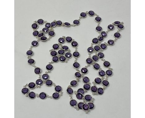 A silver and facet cut amethyst necklace 