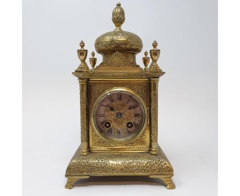 A mantel clock, the 6 cm diameter silvered chapter ring with Roman numerals fitted an eight day movement, striking on a bell,