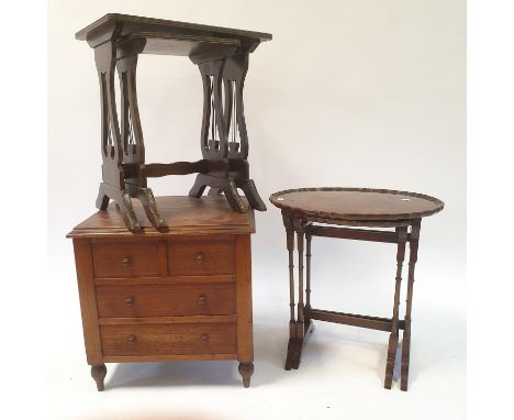 A 19th century mahogany wine table, 53 cm diameter, a commode, two nests of two tables, and a stool (5) 