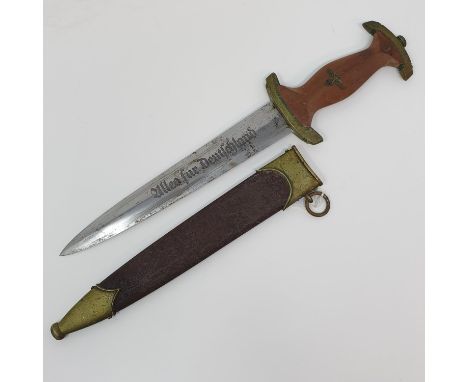 A Third Reich SA dagger the blade marked Rob Giersch, Solingen, with a scabbard, stamped 15/25063, attic stored Provenance br