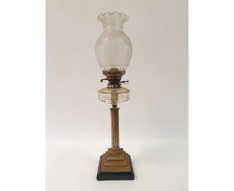 An oil lamp, with an acid etched glass shade, and a clear glass well on silver plated base in the form of a column, 71 cm hig