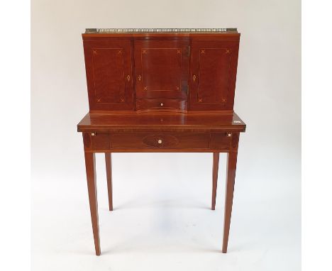 A 19th century inlaid mahogany ladies writing desk, the superstructure with three cupboard doors and a drawers revealing 15 d