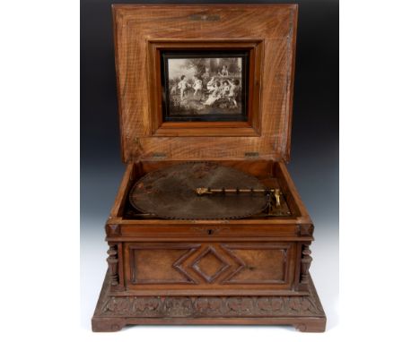A late 19th century table top Polyphon, 11986, playing 40 cm discs, in a walnut case, some loss, attic stored, 58 cm wide, wi