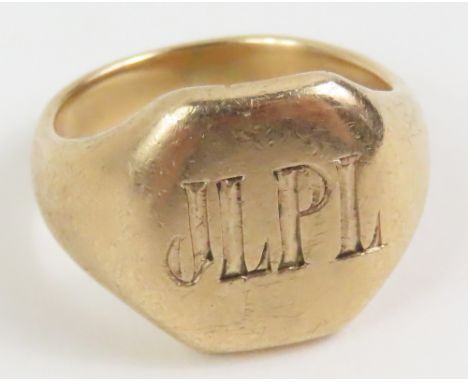 A heavy signet ring, the octagonal shaped head monogrammed, finger size K, marked '9ct', 8.4g gross