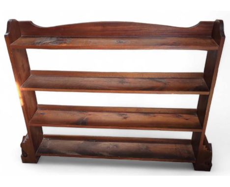 A stained pine open book shelf 112cms high max 146cms wide max