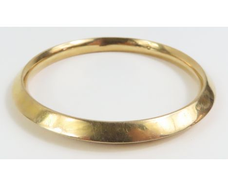 A 9ct gold bangle, with pointed profile, internal diameter 6.7cm, 12.2g gross