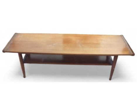 A c.1970's rectangular teak coffee table with lower magazine shelf, 36.5cms high 113cms wide