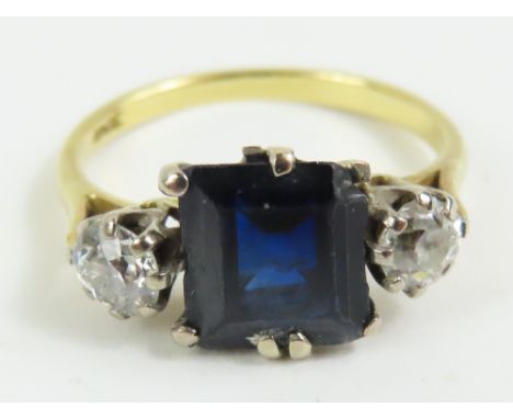 A sapphire and old cut diamond three stone ring, marked '18ct', finger size M, 3.3g gross