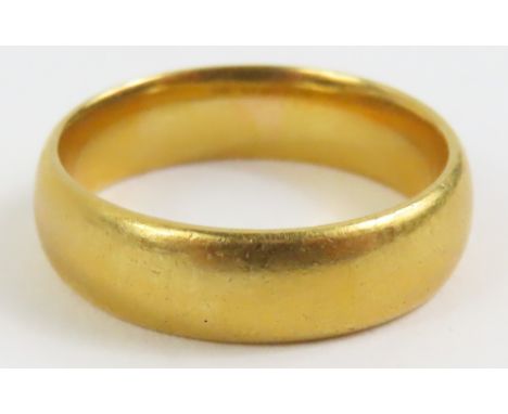 A plain 22ct gold wedding band, finger size M 1/2, 6.9g gross