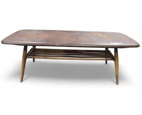 A mid century Ercol rectangular coffee table with lower tier and on splay supports, 104cms wide