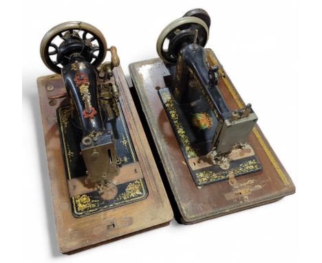 Two manual sewing machines in wood cases (2)