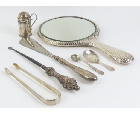 A silver backed hand mirror; George III silver sugar tongs, silver pepperette, silver caddy spoon and salt spoon total weight