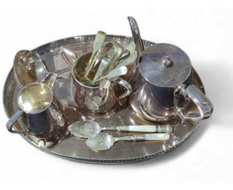 A quantity of silver plate including an oval galleried tray, ladle and tea service