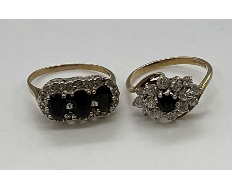 Two 9ct yellow gold dress rings set with sapphires, combined approx. 5.4g (2).Cluster size M, triple stone ring L