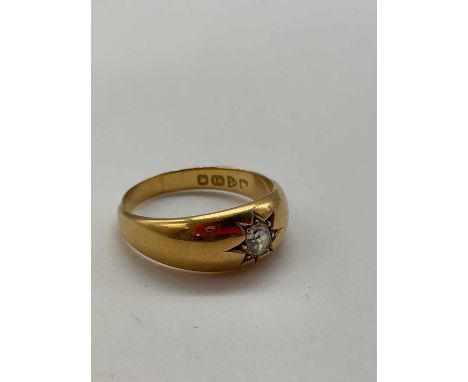 An 18ct yellow gold and diamond 'gypsy ring', with old cut stone, approx 0.20ct, size ) 1/2, approx 5g.Condition Report: Ther