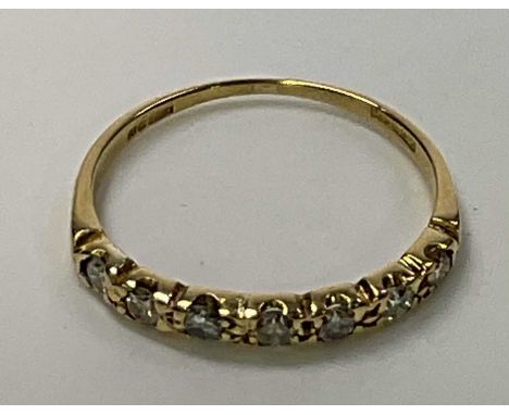 An 18ct yellow gold seven stone half eternity ring, size O, approx. 1.7g. 