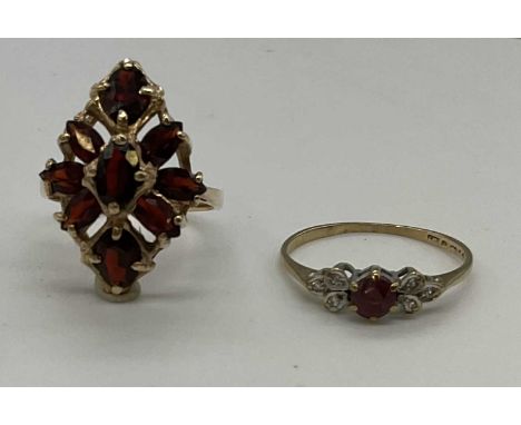 Two 9ct yellow gold dress rings, one set with garnets, combined approx. 5.3g (2). Garnet ring L, other L1/2