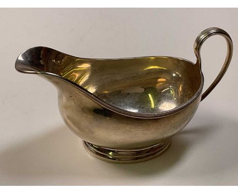 J. B. CHATTERLEY &amp; SONS; a George VI hallmarked silver Art Deco designed sauce boat with reeded detail to the rim and han
