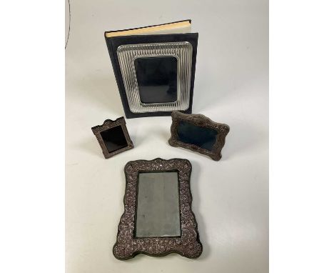 A silver fronted velvet easel backed photograph frame, a wooden backed similar smaller example, a velvet easel backed mirror 