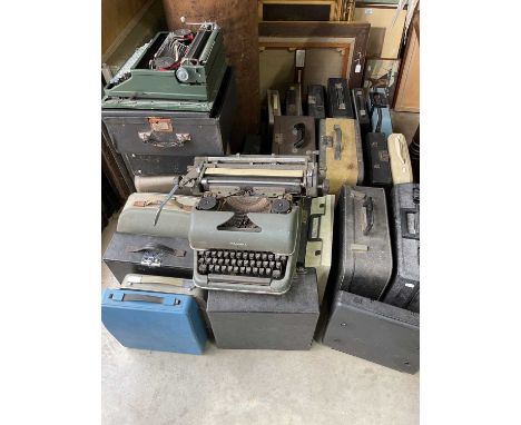 A large quantity of vintage typewriters.