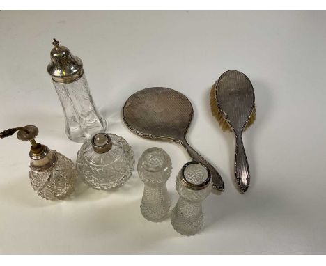 A group of silver mounted items including a cut glass sugar caster, Sheffield 1908, an atomiser, vase, also dressing table mi