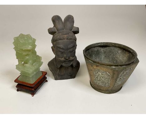 A carved jade dragon, a bust of a Chinese man and a brass planter.