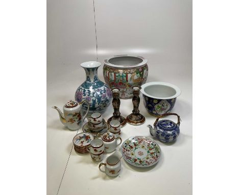 A quantity of Oriental ceramics; including a gold fish bowl, a planter, candlesticks, tea set and others.