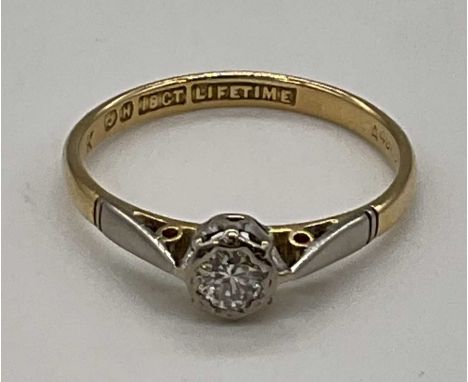 An 18ct yellow gold diamond solitaire ring in rubover setting, size O, approx. 2.1g.