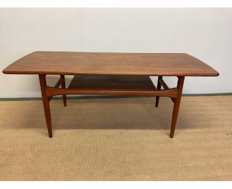 G-PLAN; a mid 20th century Kofod Larsen teak coffee table with magazine shelf.