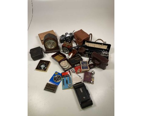 A small group of cameras, a GPO compass, playing cards, various collector's items, etc.