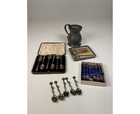 A cased set of six hallmarked silver coffee spoons, a set of six Thai white metal spoons, a set of five white metal spoons an