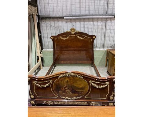 A French ormolu mounted mahogany bed, late 19th century/early 20th century, the serpentine headboard, footboard and rails set