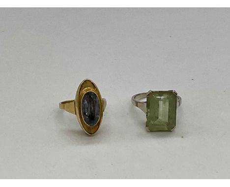 A 14ct yellow gold dress ring set with pale blue stone, size O and a 14ct white gold dress ring size Q, combined approx. 10.3