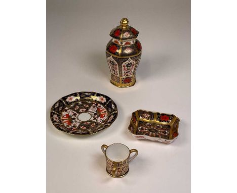 ROYAL CROWN DERBY; an 'Old Imari' 1128 hexagonal jar and cover, a 1128 small trinket dish, a 2451 miniature tyg and an Imari 