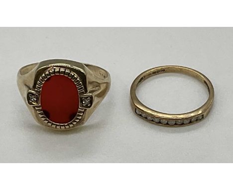 A 9ct yellow gold signet ring set with carnelian and a 9ct yellow gold half eternity ring, combined approx. 5.6g (2).Conditio