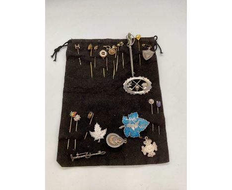 A group of stick pins, tie pins and brooches including several 9ct yellow gold examples, silver, some set with marcasite, one