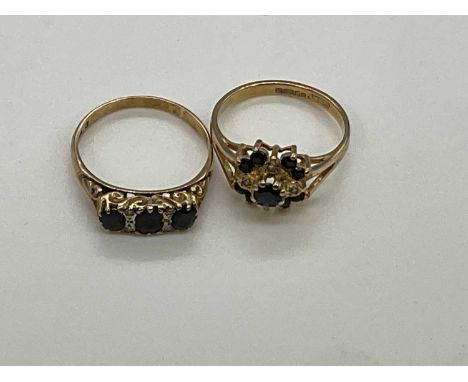 Two 9ct yellow gold dress rings each set with sapphires, combined approx. 5.8g (2). Three stone ring Q, Cluster O1/2