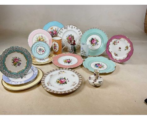 A collection of Royal Crown Derby cabinet plates and other items including a Royal Worcester bottle neck vase.