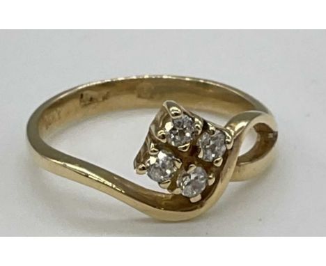 A yellow metal quatrefoil set ring stamped 'Italy 14ct', size L, approx. 2.5g.