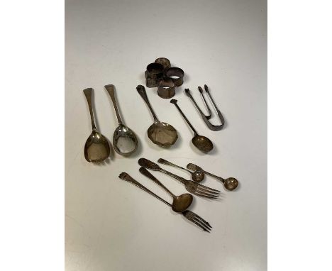 A group of small silver including five napkin rings, a Chinese spoon, Fiddle pattern small fork, pair of sugar tongs, pair of