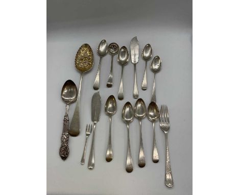 A group of silver flatware including a George V hallmarked silver single berry spoon, Glasgow 1913, eight various teaspoons, 