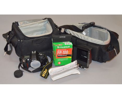 Nikon F80 camera body, 5x4 Polaroid back with films etc contained in two camera bags