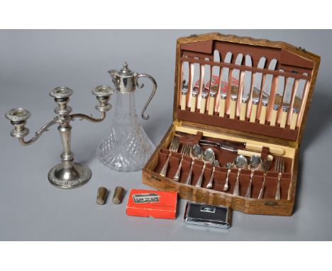 A mixed lot of metalware including 2 salts (one marked 925) together with a claret jug, candlestick and canteen of cutlery et