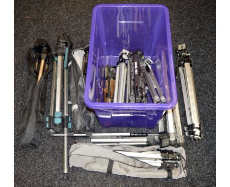 A quantity of camera tripods