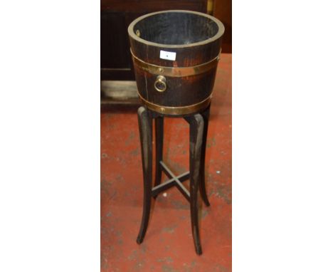 An oak hall planter with brass banding