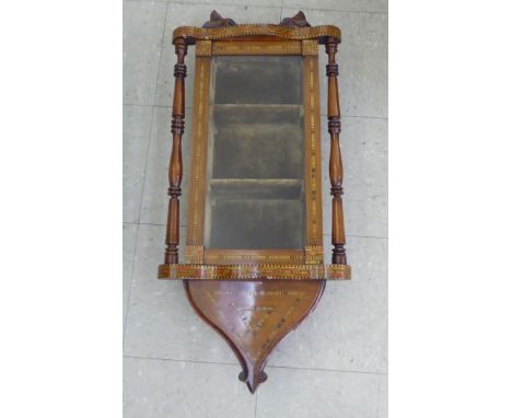 A late 19thC mahogany and marquetry ornamented wall clock case, converted for display purposes, the full height glazed door e